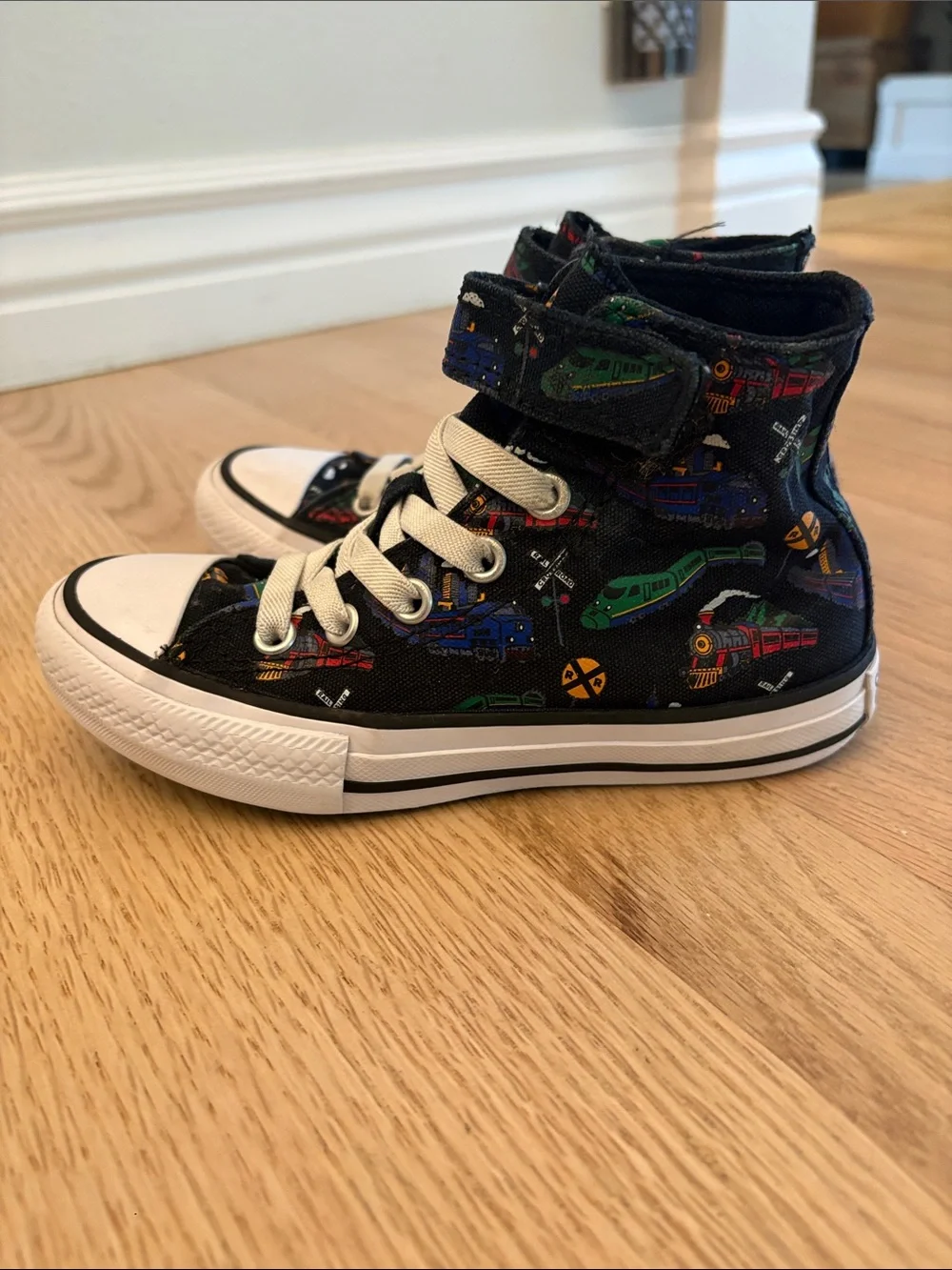 Kids Converse High-Top Sneakers in Black with Colorful Train Print